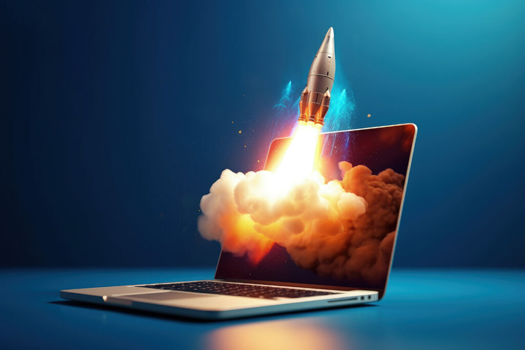 A rendered image of a rocket taking off from within a Laptop screen and breaking free.