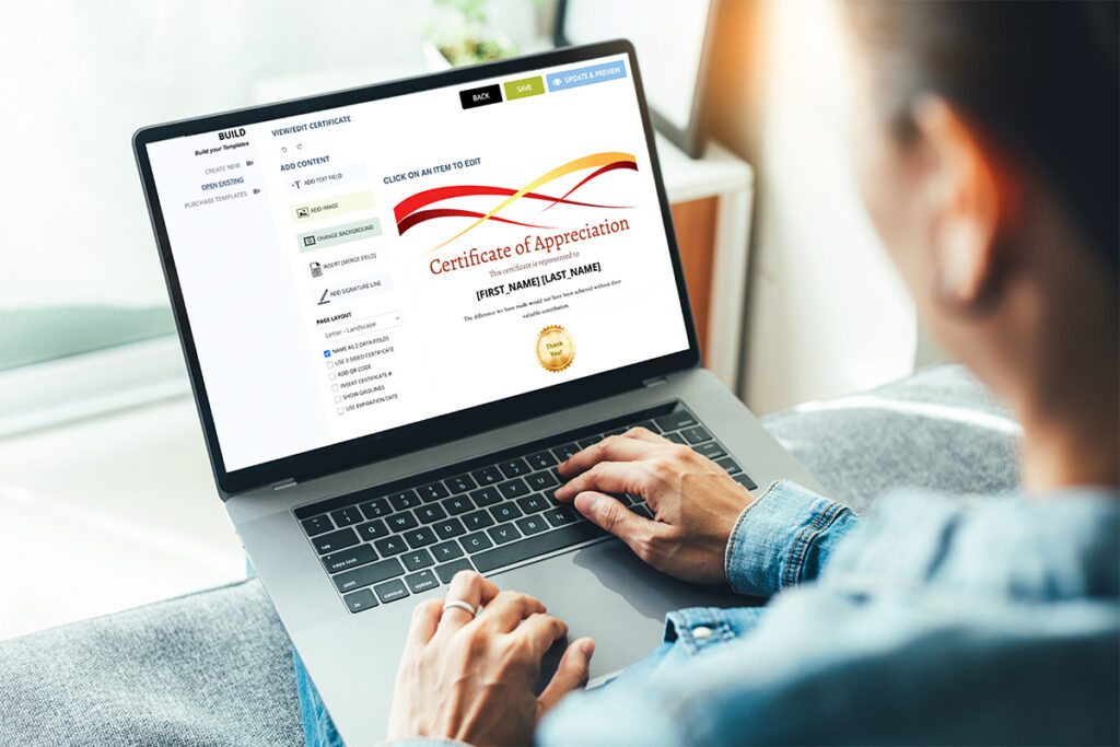 man using laptop to create certificates